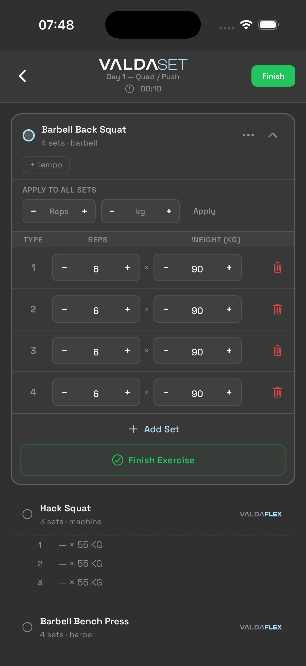 Workout logging screen with sets, weight, reps